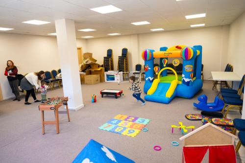 a child playing in a room with a play equipment at EVIA FOREST VILLAGE in Pappádhes