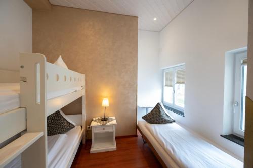 Postel nebo postele na pokoji v ubytování Toni's Alpine Loft & SPA