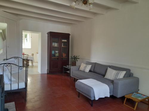 a living room with a couch and a table at Vacation Rental in Ambleville