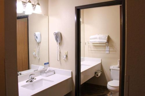 a bathroom with a sink and a toilet and a phone at Quality Inn Gunnison-Crested Butte in Gunnison