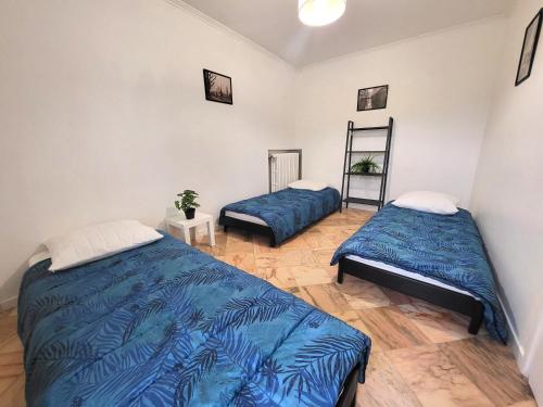 Postel nebo postele na pokoji v ubytování D St-Quentin-en -Yvelines Plusieurs appartements