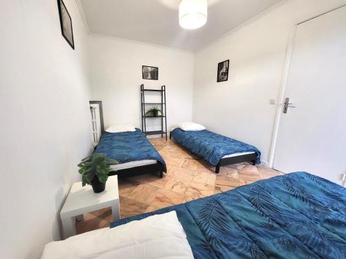 Postel nebo postele na pokoji v ubytování D St-Quentin-en -Yvelines Plusieurs appartements