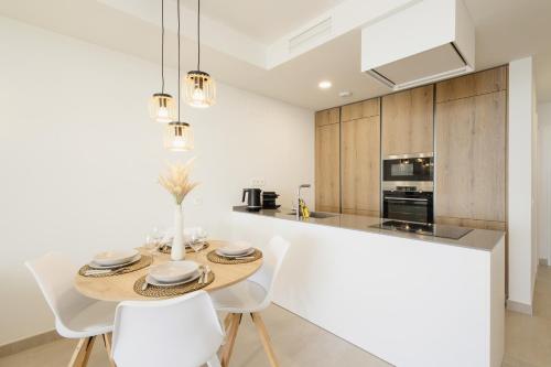Modern apartment with a large private terrace, pool, sauna, gym, and sea views in Fuengirola