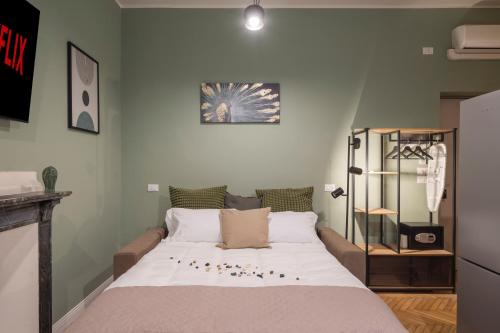 a bedroom with a large bed with balls on it at Loreto Prestige - Parking Free & Bulb Gym in Milan