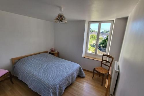 Ένα ή περισσότερα κρεβάτια σε δωμάτιο στο Maison de charme Bléré-Chenonceaux