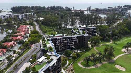 an aerial view of a resort with a park at Sky Park Laguna 1bdr Lake View in Thalang
