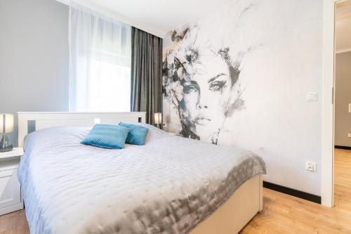 Posteľ alebo postele v izbe v ubytovaní Apartament przy Starówce