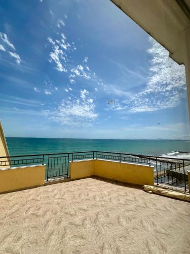 a balcony with a view of the ocean at PSB Apartments in Midia Resort Aheloy in Aheloy