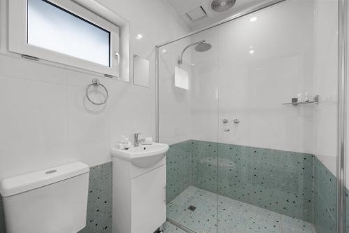 a bathroom with a toilet and a sink and a shower at Best Western Adelaide Airport in Adelaide