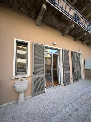 a facade of a building with doors and a window at Residenza la Torretta in Domodossola
