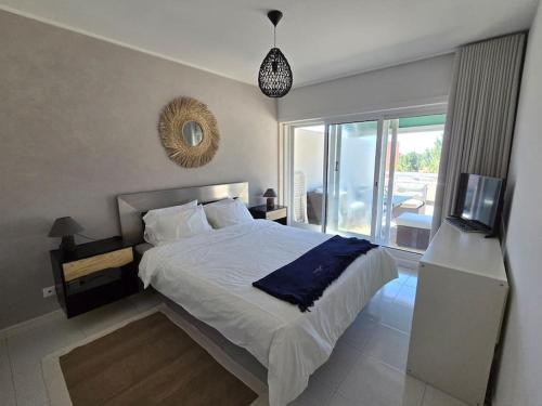 Ένα ή περισσότερα κρεβάτια σε δωμάτιο στο Viana beach apartment