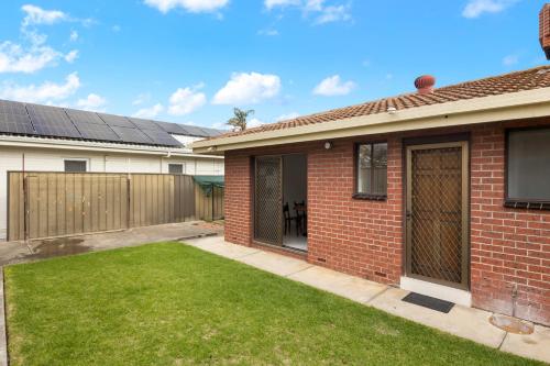 a home with solar panels on the roof at Best Western Adelaide Airport in Adelaide