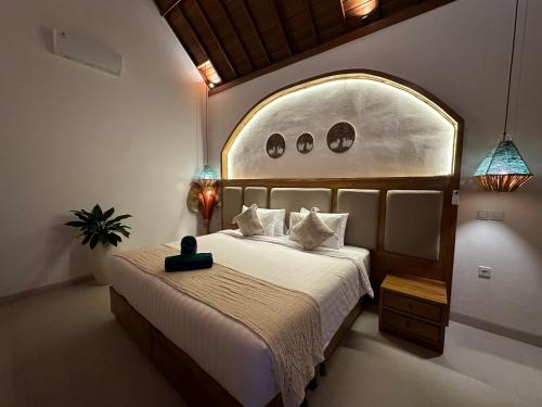 a bedroom with a large bed with a large window at The Lava Bali Villa and Hot Spring in Kintamani