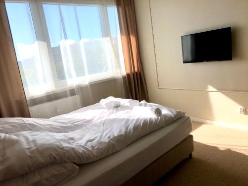 Ένα ή περισσότερα κρεβάτια σε δωμάτιο στο Sands Startowa Pokoje