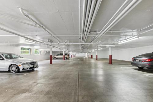 a parking garage with two cars parked in it at Holiday Inn Express & Suites Mountain View Silicon Valley by IHG in Mountain View