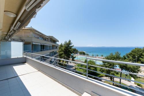 a balcony with a view of the ocean at The Residence Aparthotel in Podstrana