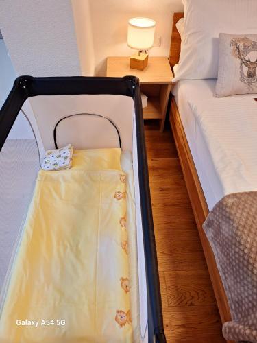 a suitcase sitting on a bed in a room at Apartment Katharina in Spital am Pyhrn