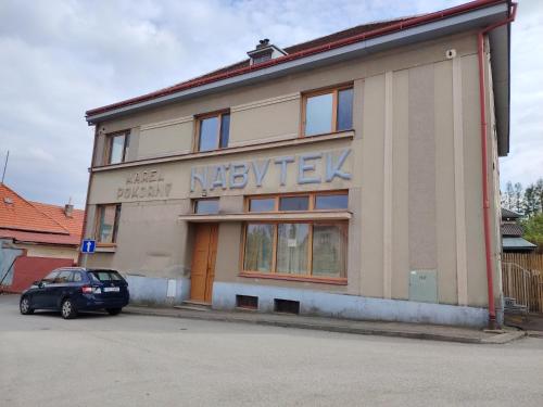 a building with a car parked in front of it at Pacov 501 in Pacov