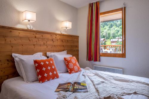Кровать или кровати в номере Résidence Pierre & Vacances Les Ravines