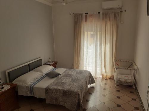 Postel nebo postele na pokoji v ubytování Casa dello Scoglio nel mare