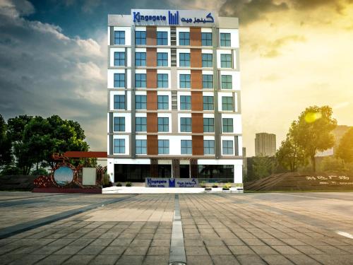 a rendering of a hotel building with a parking lot at Kingsgate Canal Hotel by Millennium in Dubai