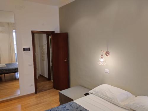 Postel nebo postele na pokoji v ubytování Amedeo Square