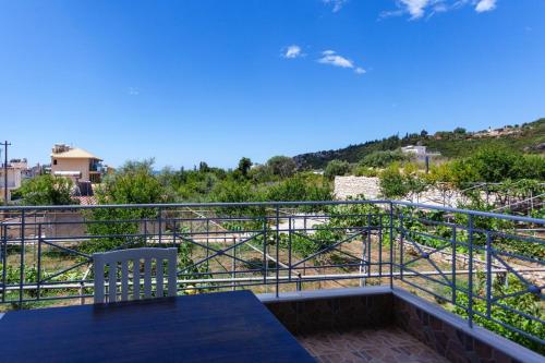a balcony with a table and a view at Zacharias apartments in Himare