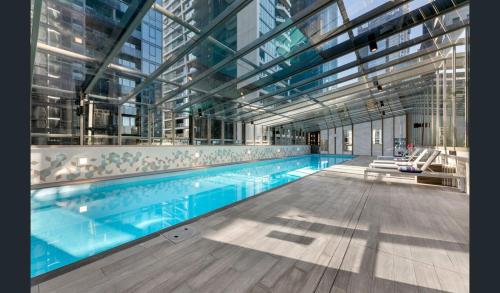 a large swimming pool in a building at Southbank, River View, Free Parking in Melbourne