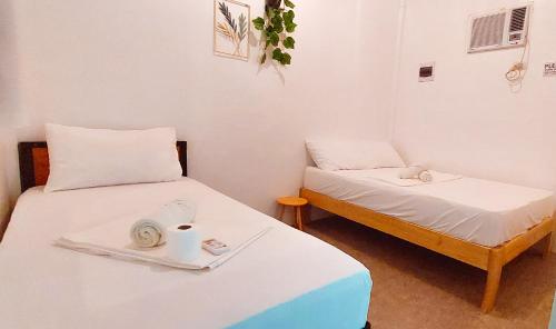 Postel nebo postele na pokoji v ubytování Camotes Hostel Resort