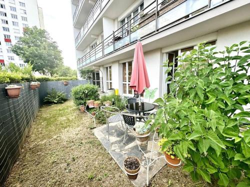 Appartement avec 2 jardins privés