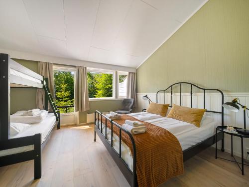 Postel nebo postele na pokoji v ubytování Hardanger Guesthouse
