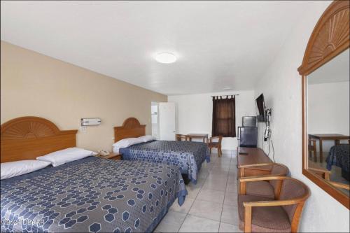 Ένα ή περισσότερα κρεβάτια σε δωμάτιο στο A1A Travel Inn