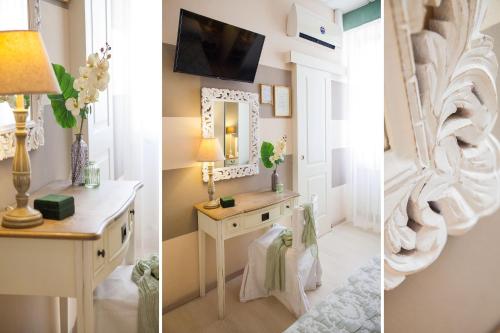 a room with a dressing table and a mirror at Hotel Tina in Diano Marina