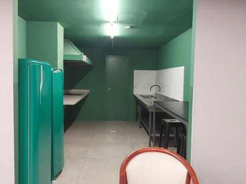 Η κουζίνα ή μικρή κουζίνα στο Local aconchegante central