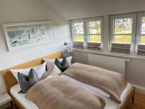 En eller flere senge i et værelse på Haus Rystsandt