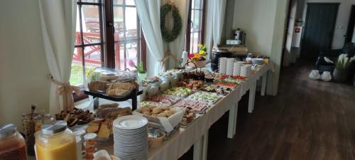 a buffet line with many different types of food at Largo Lake Resort Kaszuby in Borsk