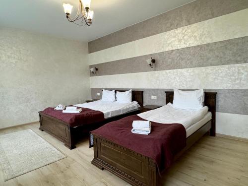 Кровать или кровати в номере Gold Palace Wellness & Spa