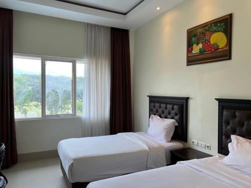 Ένα ή περισσότερα κρεβάτια σε δωμάτιο στο Kirei Hotel