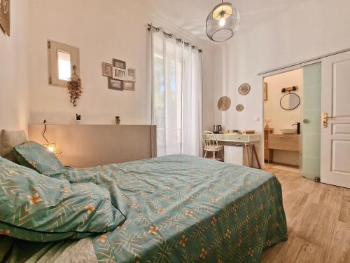 a bedroom with a bed and a desk at Family Room in Nice