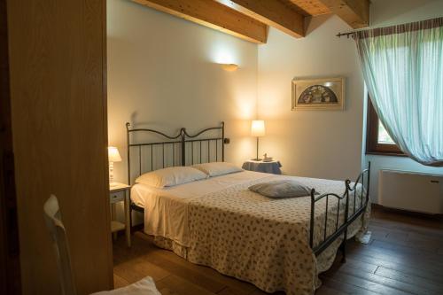 Postel nebo postele na pokoji v ubytování Agriturismo Corte Morandini