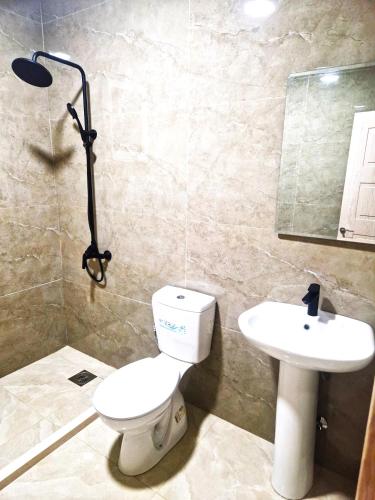 a bathroom with a toilet and a sink at IVANA Apartments in Ulcinj