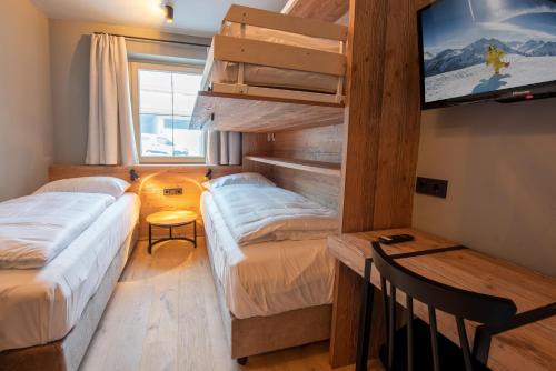 Postel nebo postele na pokoji v ubytování Filzsteinresort Wohnungen Top 1