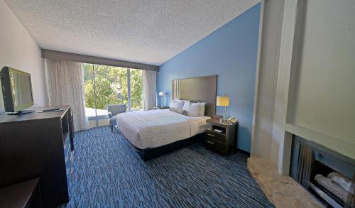 a hotel room with a bed and a fireplace at Glenstone Lodge in Gatlinburg