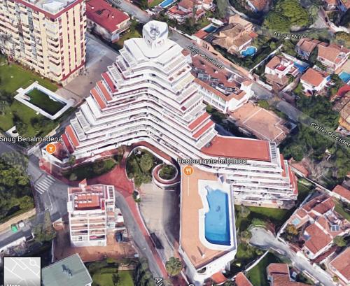 an overhead view of a large building in a city at SKYSEA Benalmadena Puerto Marina in Benalmádena