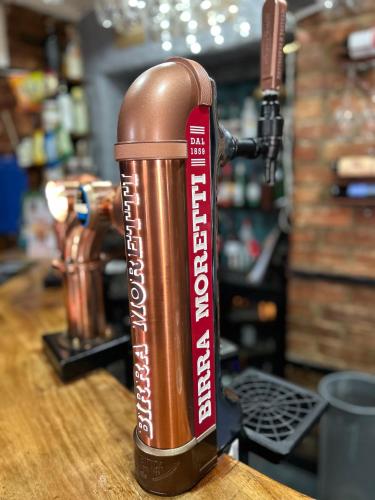 a brown thermos is sitting on a table at Angel Inn Misson in Misson