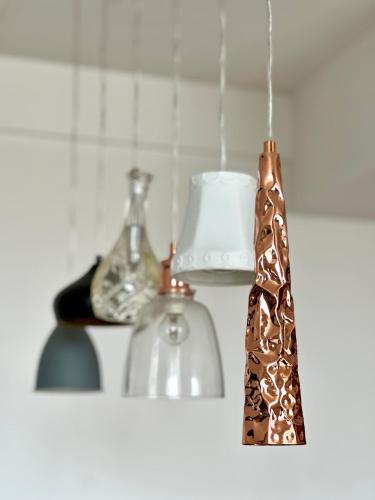 a tie that is hanging from a hook in a kitchen at L'Opéra, hyper centre de Rennes in Rennes