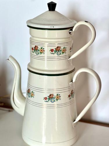 a white tea kettle with flowers on it at L'Opéra, hyper centre de Rennes in Rennes