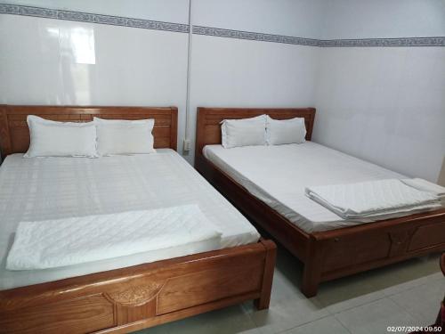Ένα ή περισσότερα κρεβάτια σε δωμάτιο στο Hai Hien Guesthouse