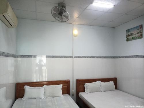 Ένα ή περισσότερα κρεβάτια σε δωμάτιο στο Hai Hien Guesthouse