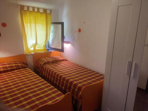 Ένα ή περισσότερα κρεβάτια σε δωμάτιο στο Vacation apartment in Falerna Marina